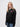 Balliol student wearing a black 1/4 zip sweatshirt