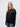 Clare student wearing a black 1/4 zip sweatshirt