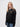 Corpus Christi student wearing a black 1/4 zip sweatshirt