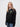 Downing student wearing a black 1/4 zip sweatshirt