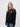 Hughes Hall student wearing a black 1/4 zip sweatshirt
