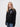 John Snow student wearing a black 1/4 zip sweatshirt
