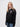 St Cross student wearing a black 1/4 zip sweatshirt