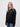 University student wearing a black 1/4 zip sweatshirt