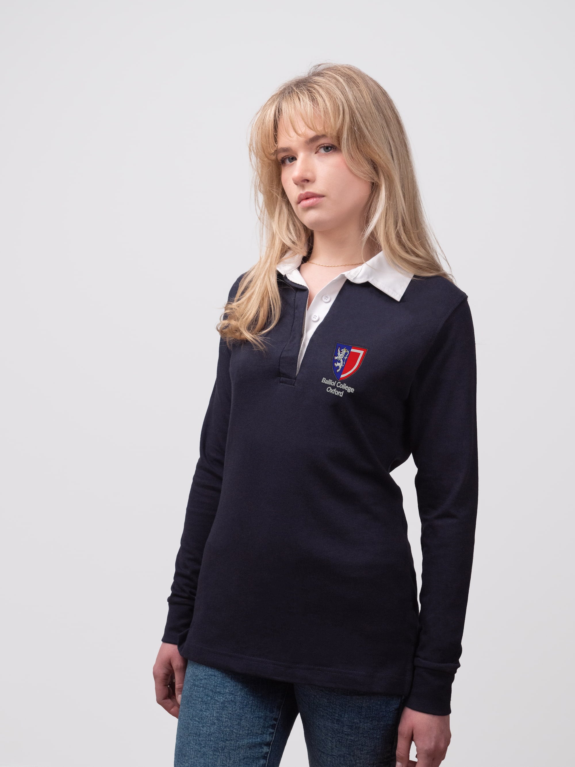 Student wearing a navy Balliol College rugby shirt with embroidered crest