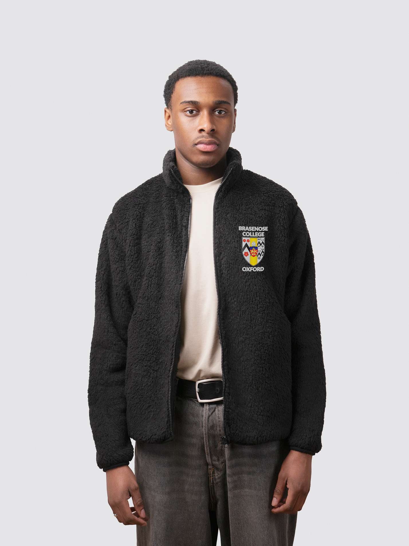 fluffy black full zip sherpa fleece, with embroidered college crest on the left chest