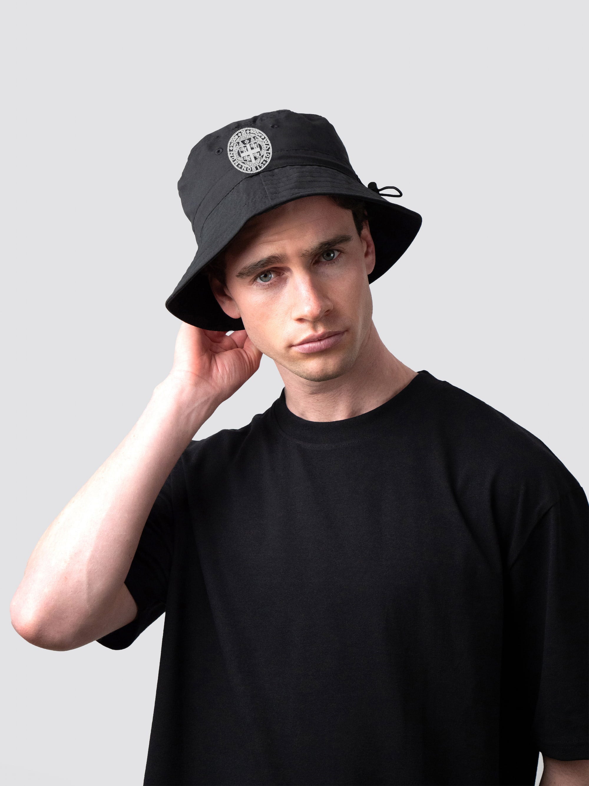 Black bucket hat, with embroidered Castle MCR College crest