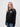 Castle MCR student wearing a black 1/4 zip sweatshirt