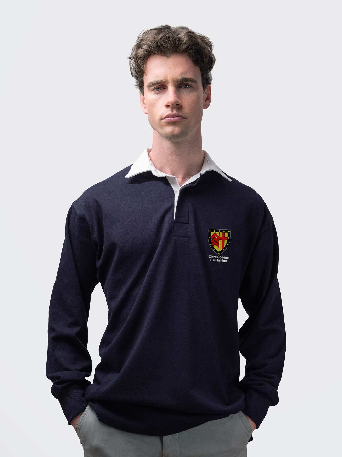Clare student wearing an embroidered mens rugby shirt in navy