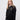 Corpus Christi student wearing a black 1/4 zip sweatshirt 