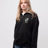 Girton student wearing a black 1/4 zip sweatshirt 