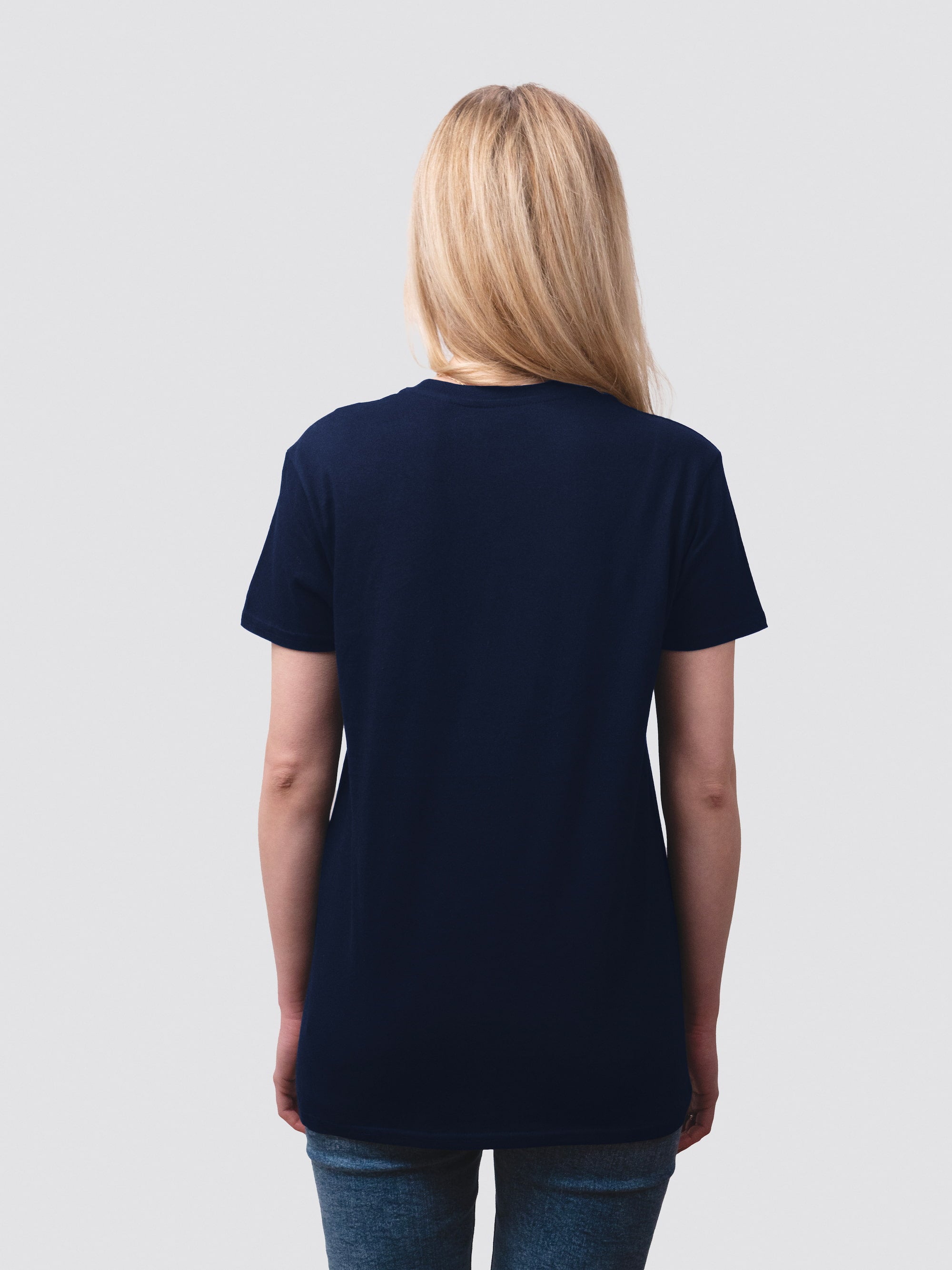 The back of a navy short-sleeve shirt, worn by a female student