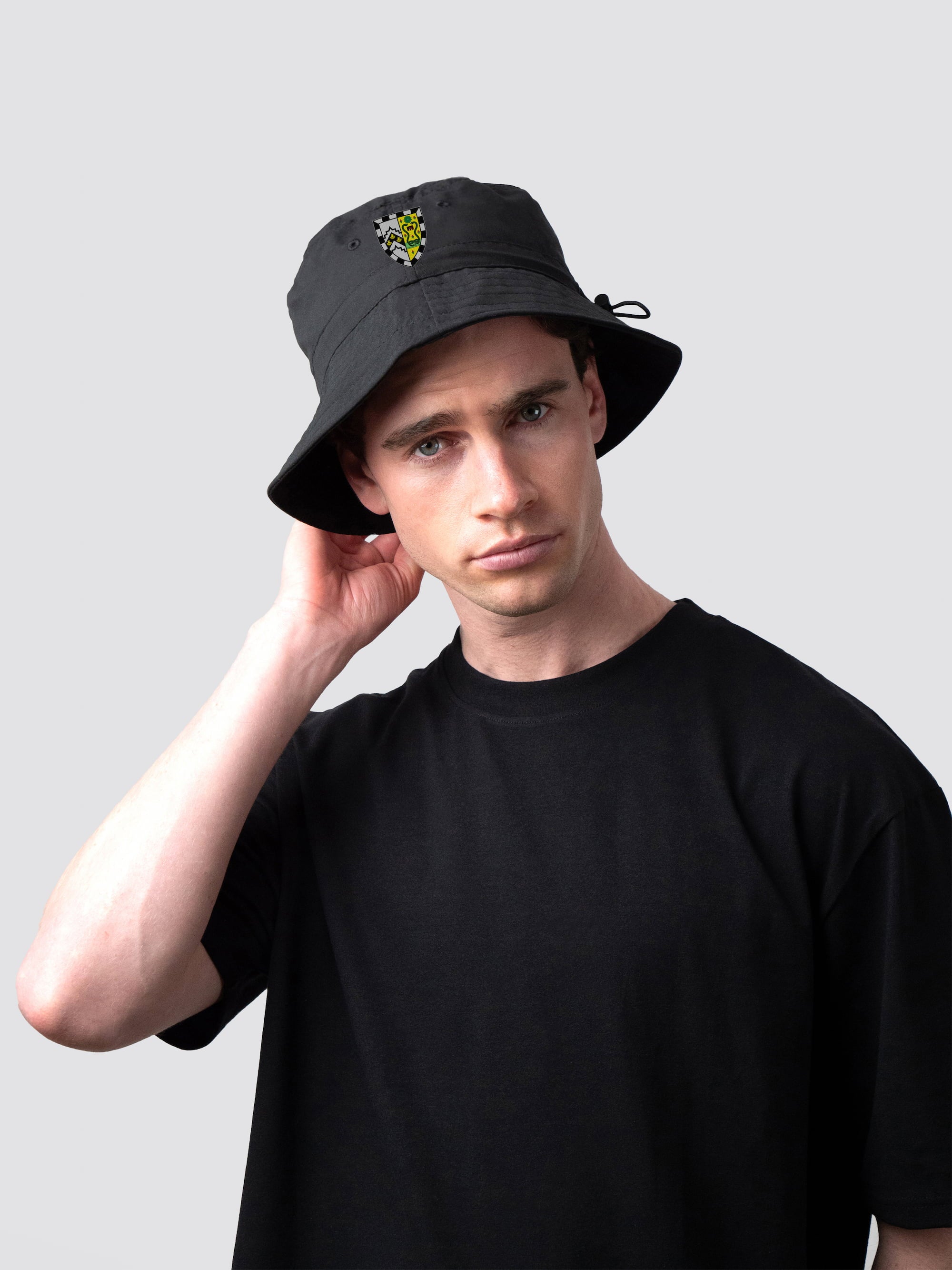 Black bucket hat, with embroidered Gonville & Caius College crest
