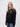 Gonville & Caius student wearing a black 1/4 zip sweatshirt