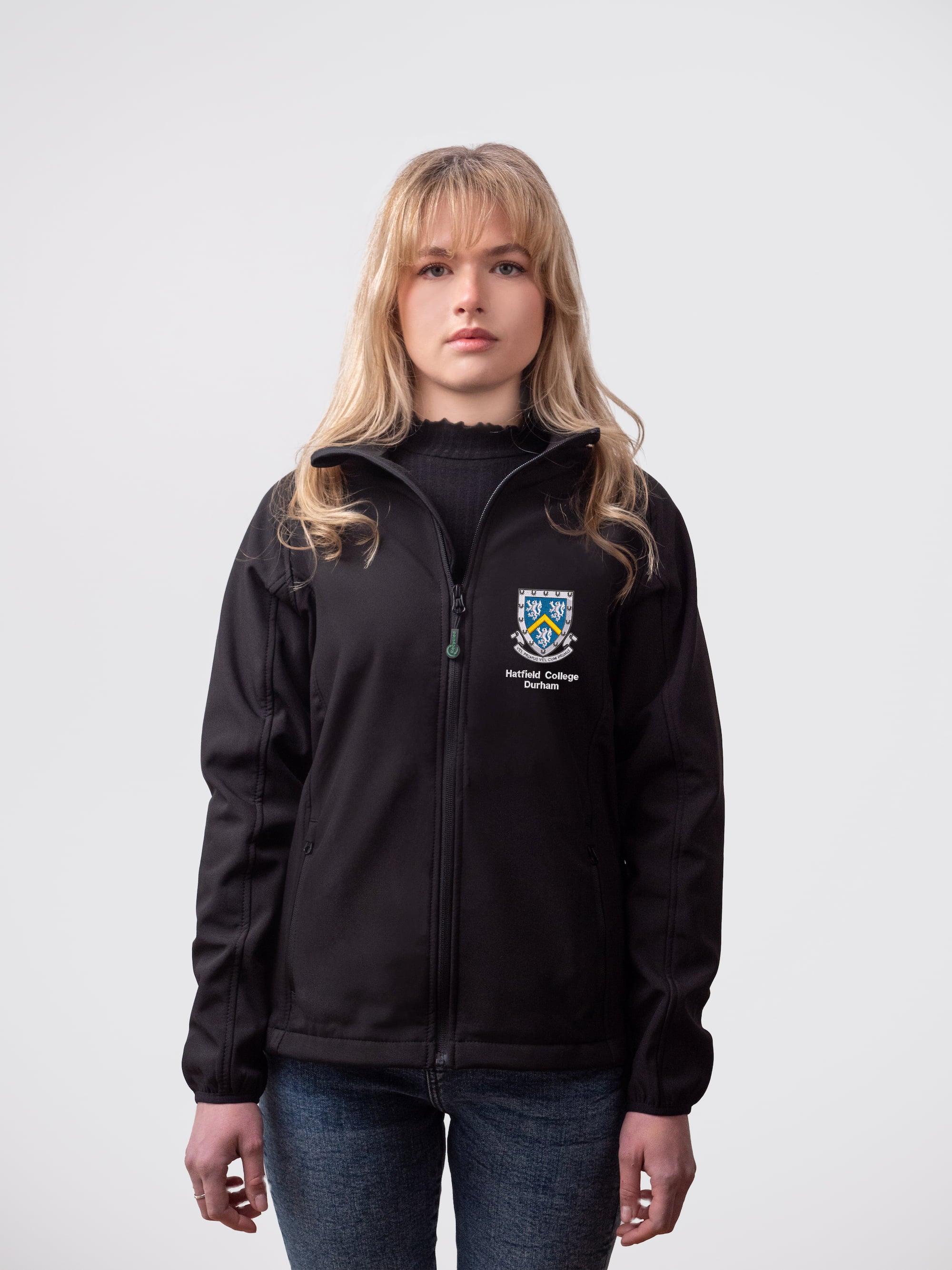 A student wearing a sustainable, Hatfield College embroidered jacket