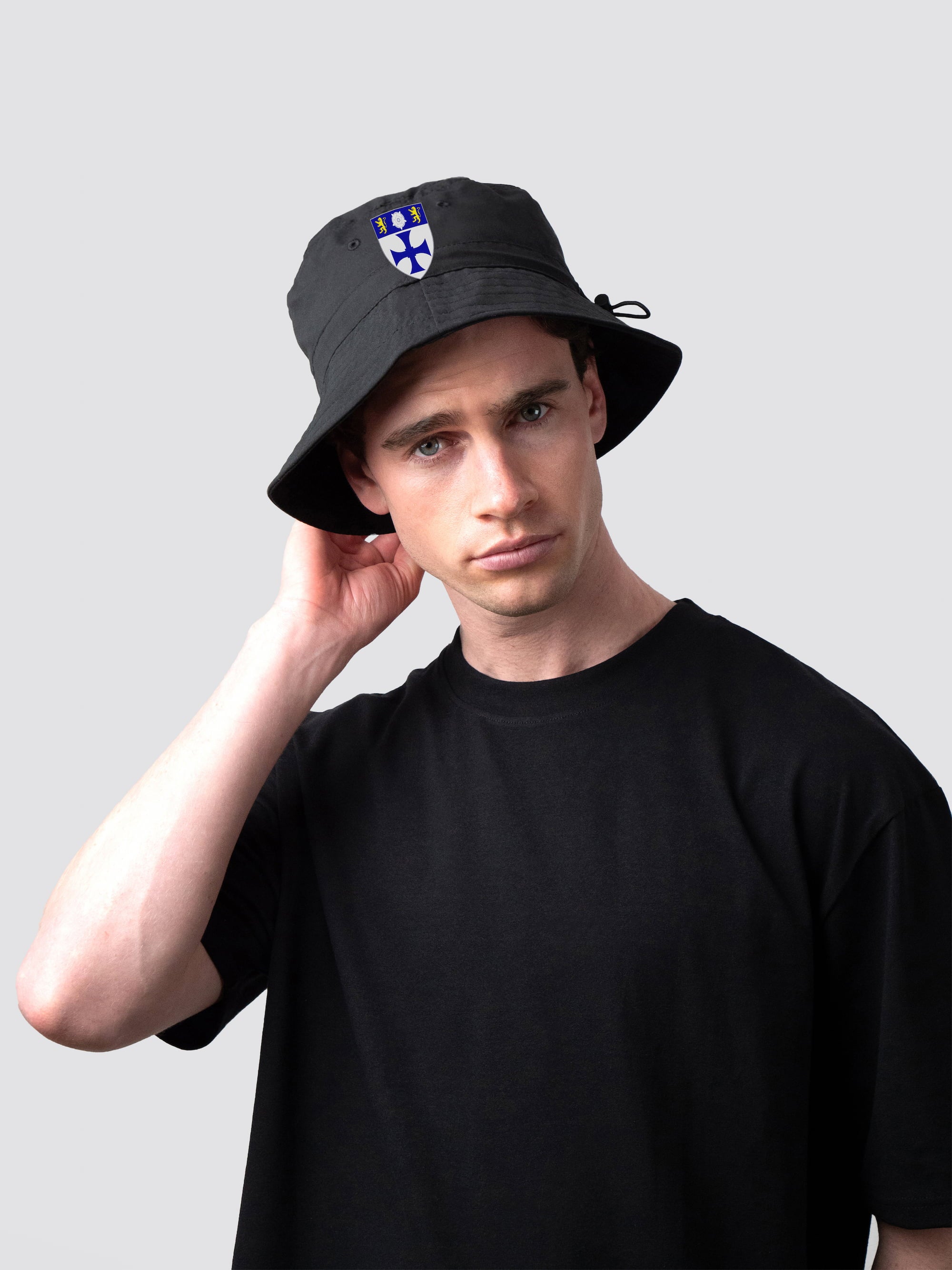 Black bucket hat, with embroidered John Snow College crest