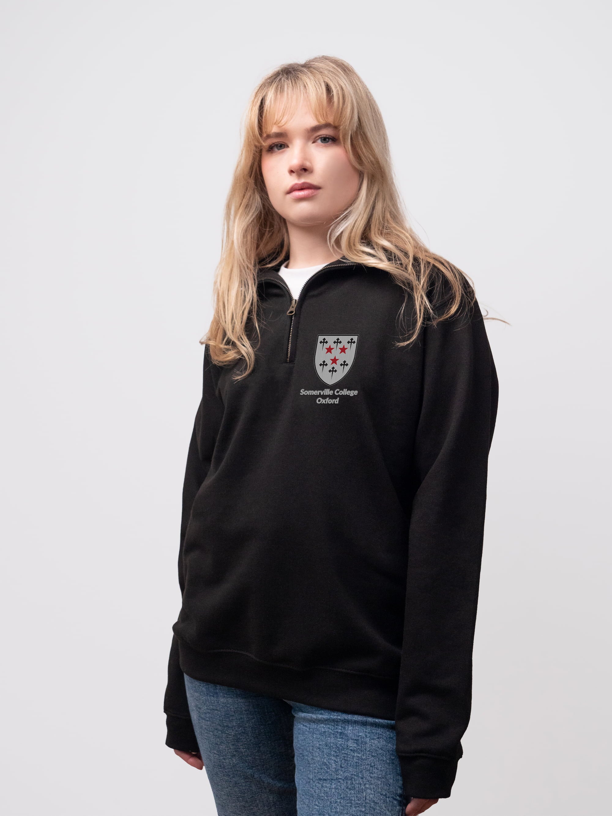 Somerville student wearing a black 1/4 zip sweatshirt 