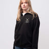St Catherine's College student wearing a black 1/4 zip sweatshirt 