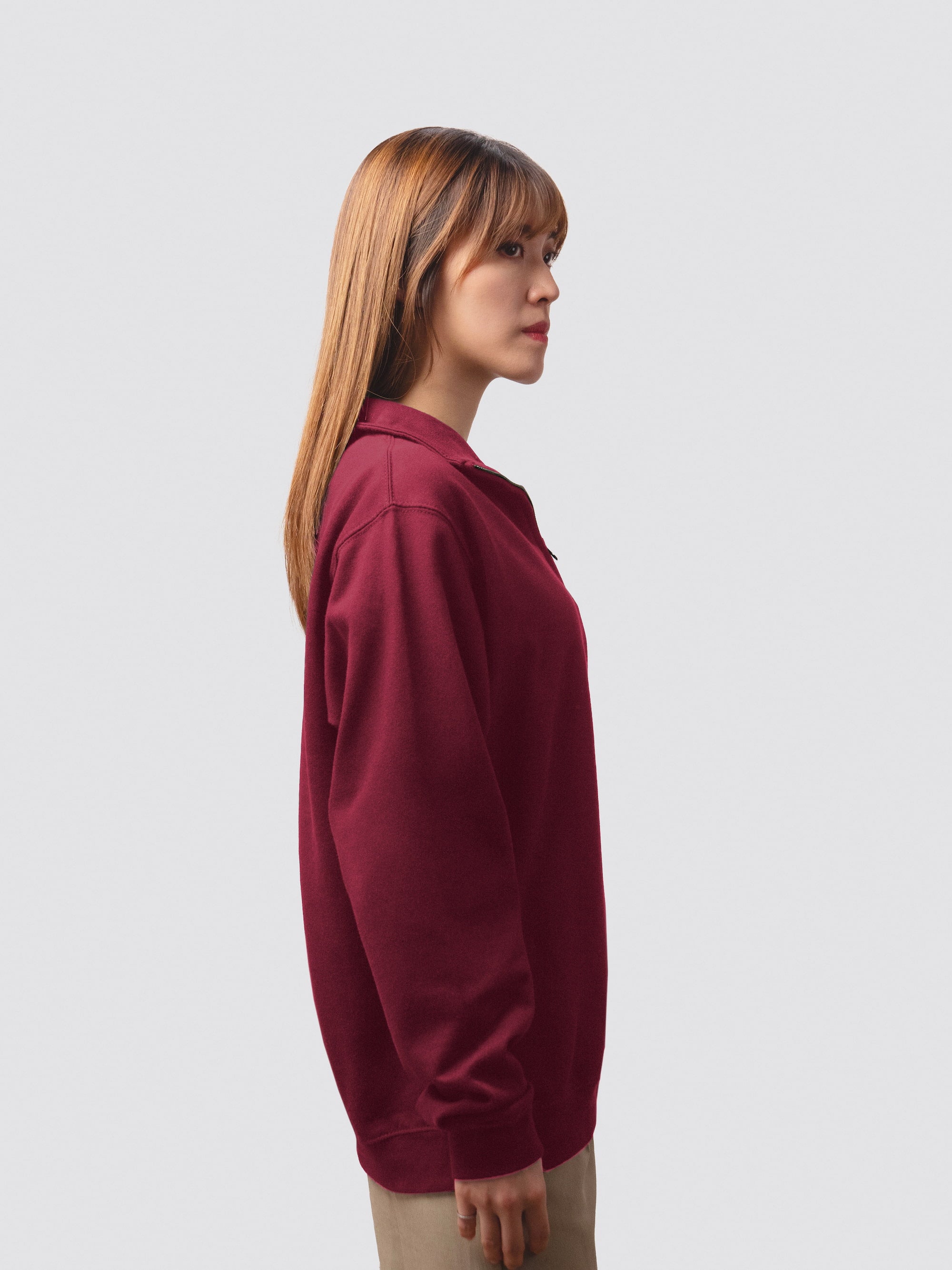 Burgundy zip-neck sweatshirt with embroidered college crest