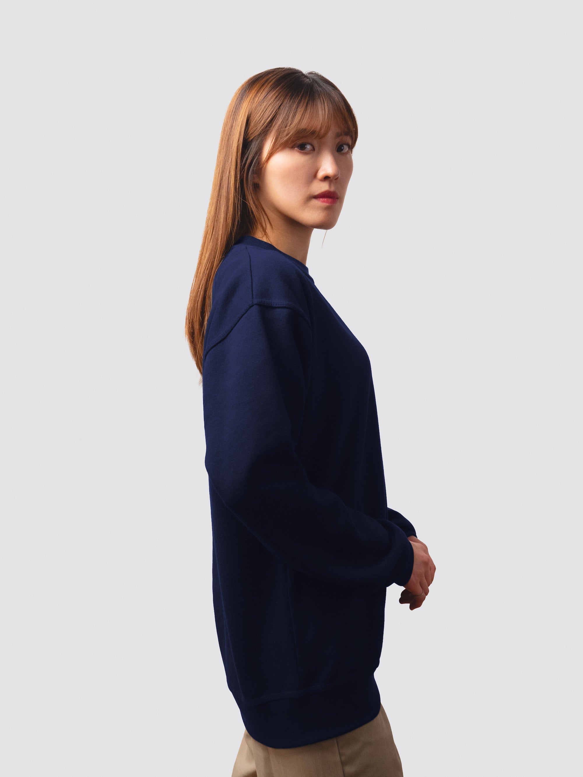 St Catherine's College sweatshirt in navy, worn by a female model