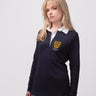 Student wearing a navy St Edmund Hall College rugby shirt with embroidered crest