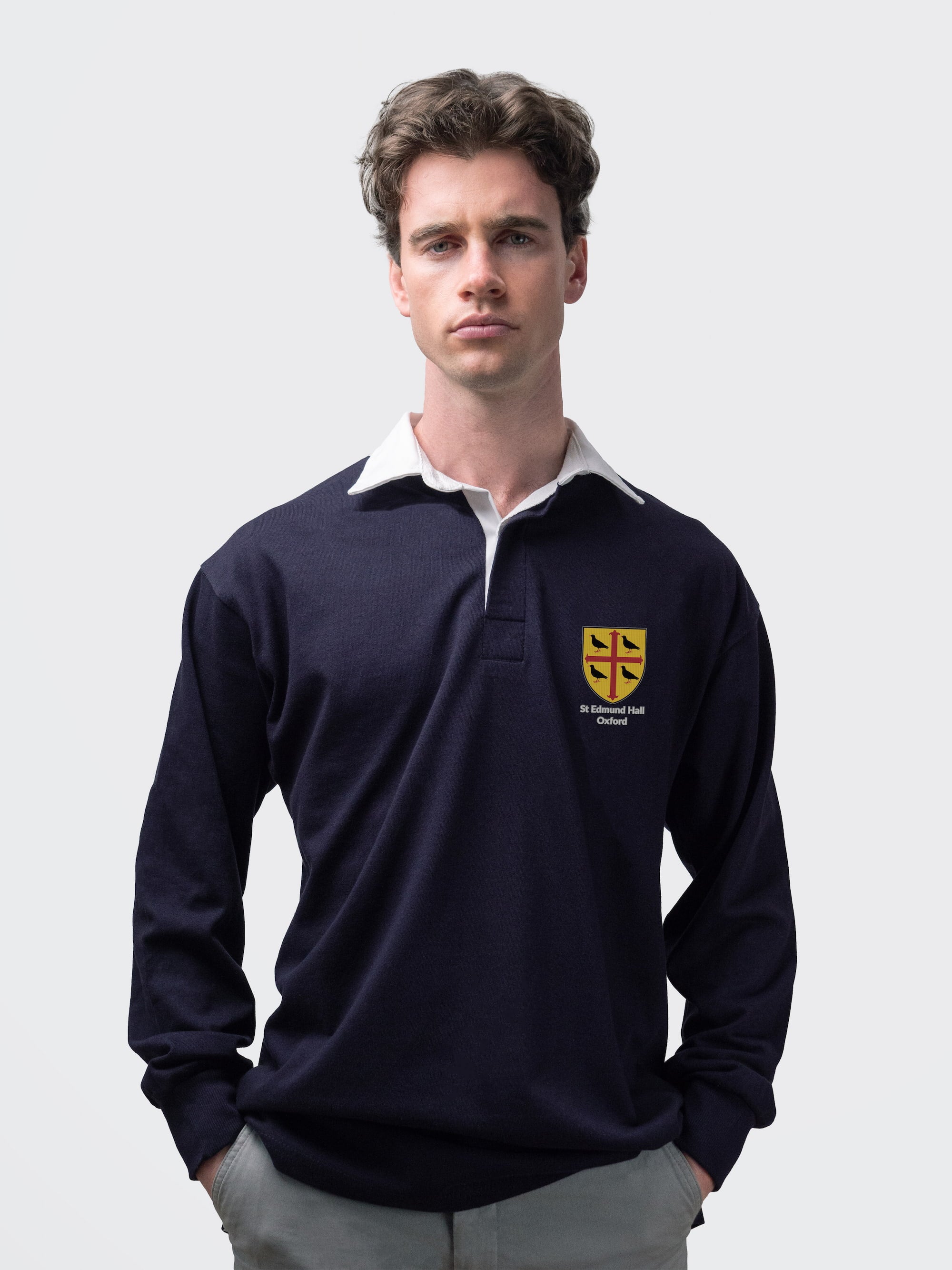 St Edmund Hall student wearing an embroidered mens rugby shirt in navy