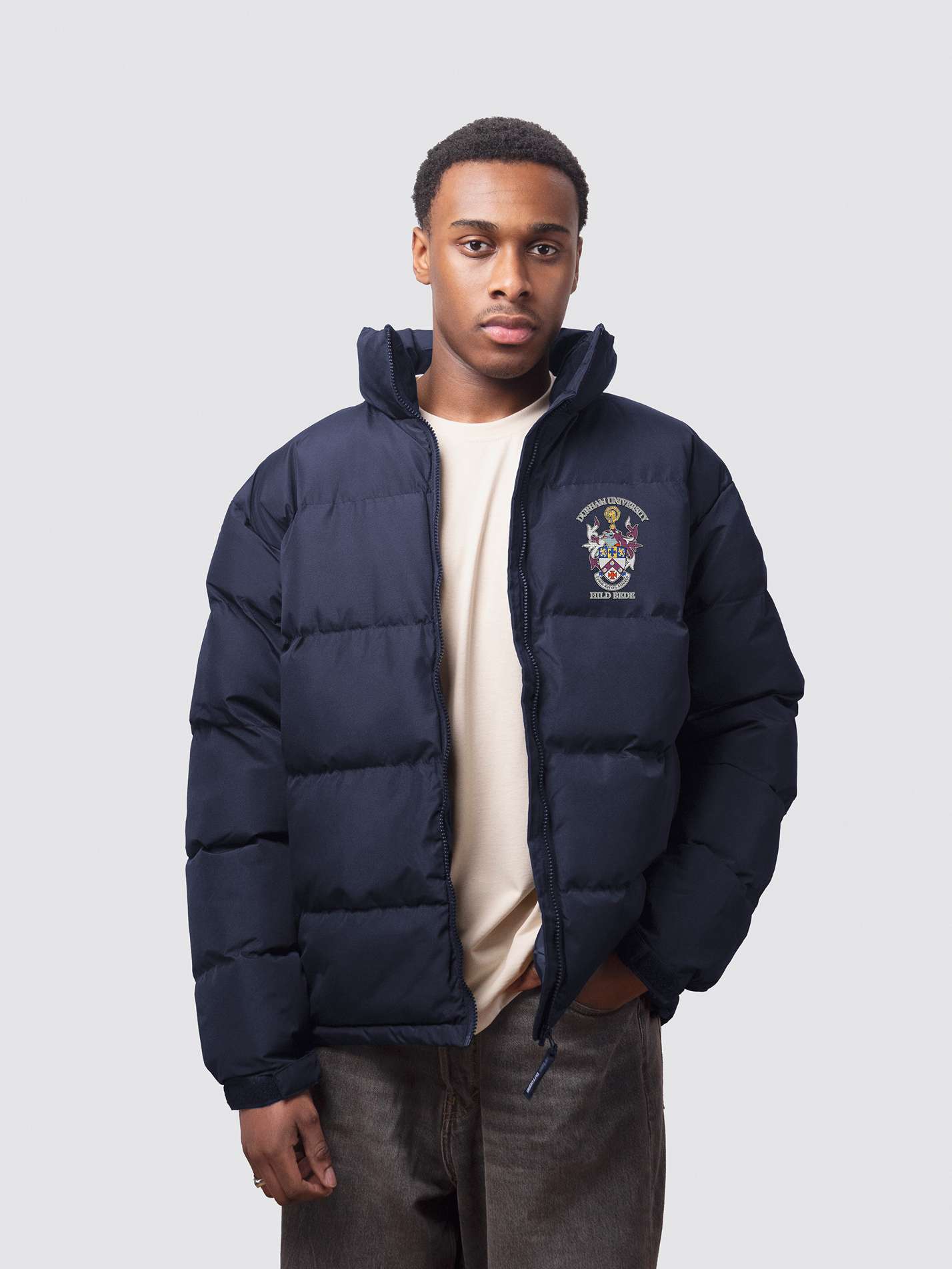 Navy Durham University puffer jacket, with embroidery on the left chest