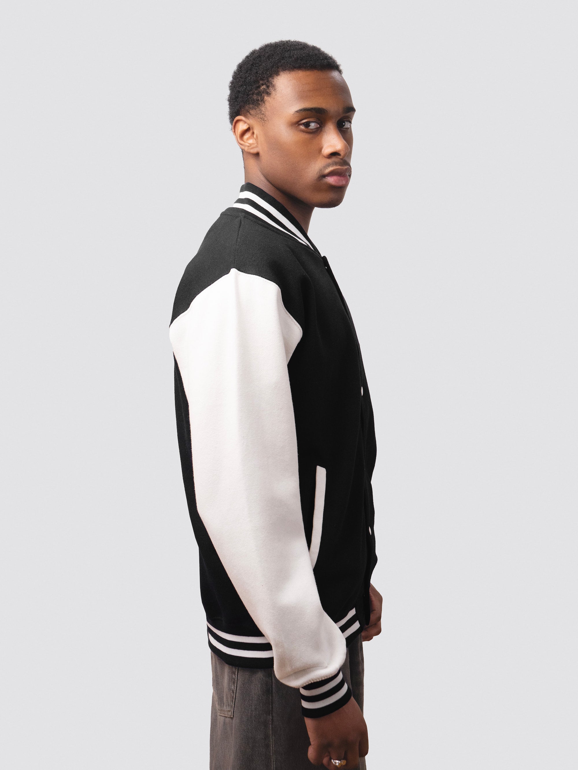 Black varsity jacket with contrast white sleeves 