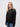 St John's student wearing a black 1/4 zip sweatshirt