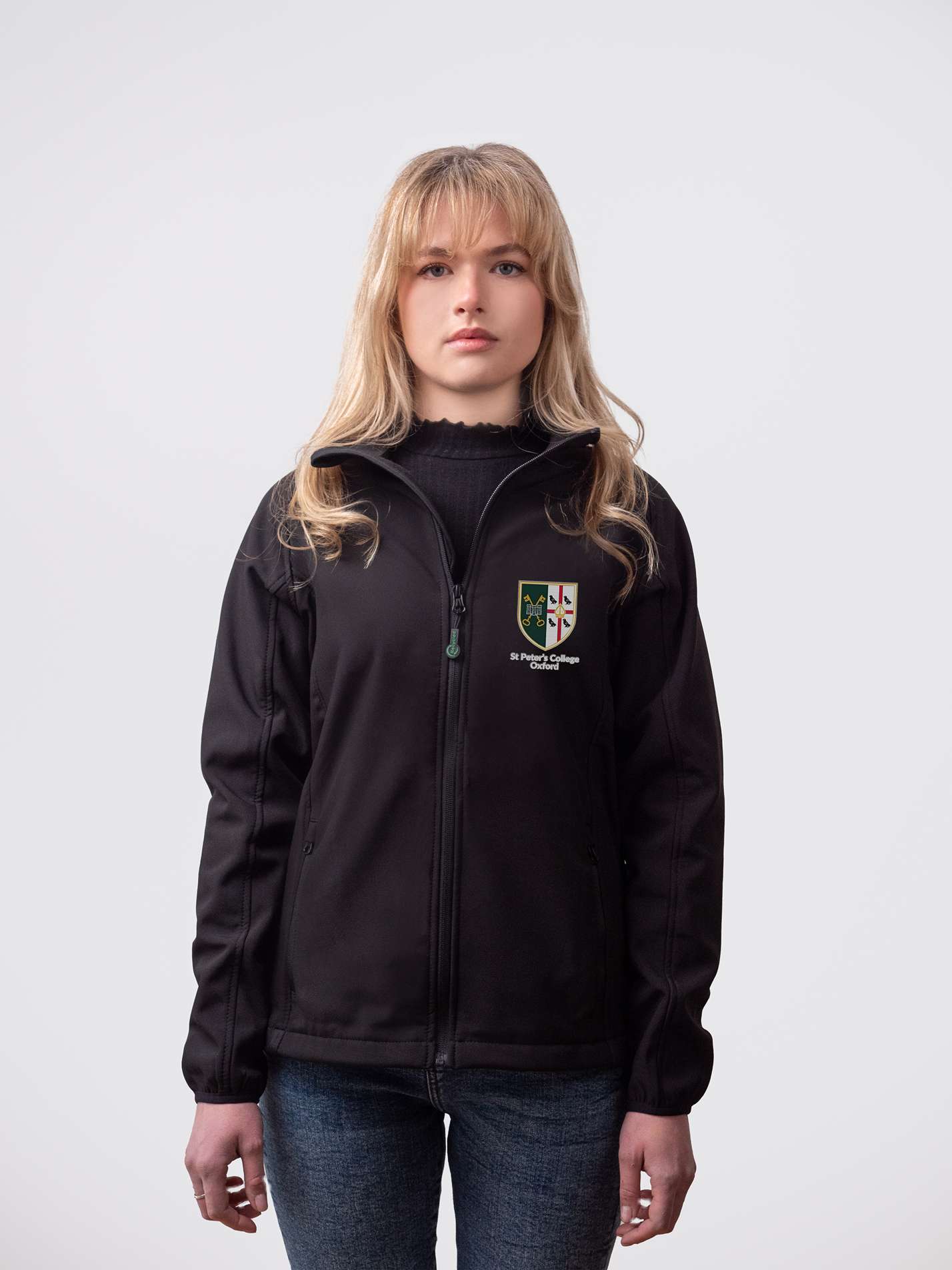 A student wearing a sustainable, St Peter's College embroidered jacket