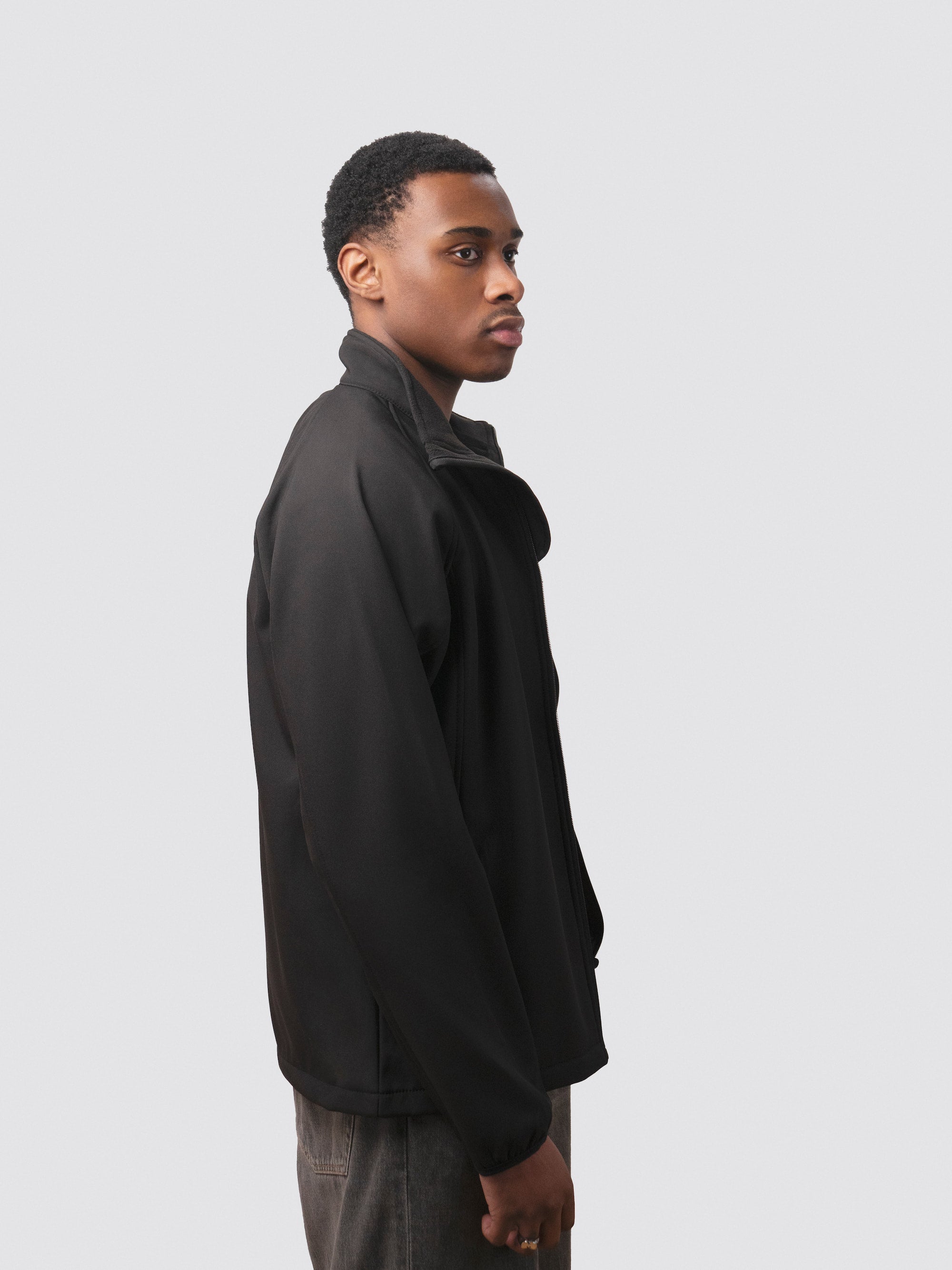 Black showerproof jacket, made from recycled plastic bottles