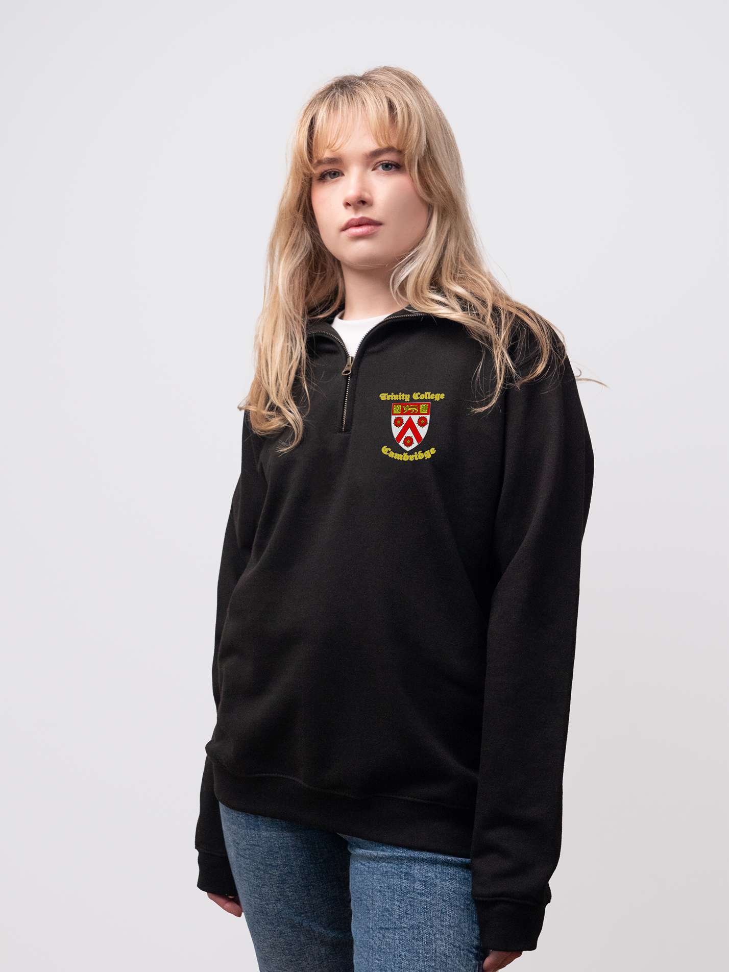 Trinity student wearing a black 1/4 zip sweatshirt 
