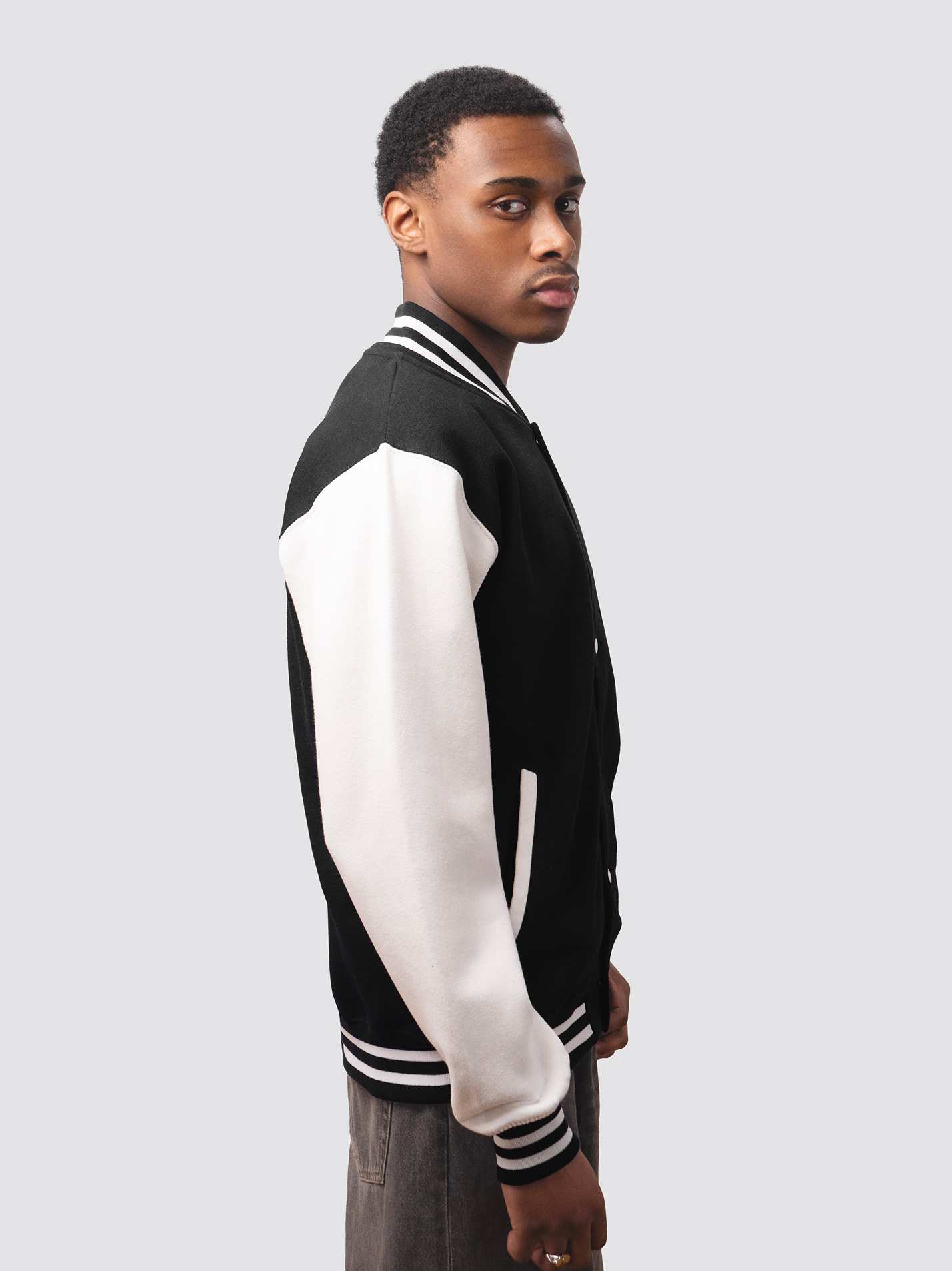 Black varsity jacket with contrast white sleeve