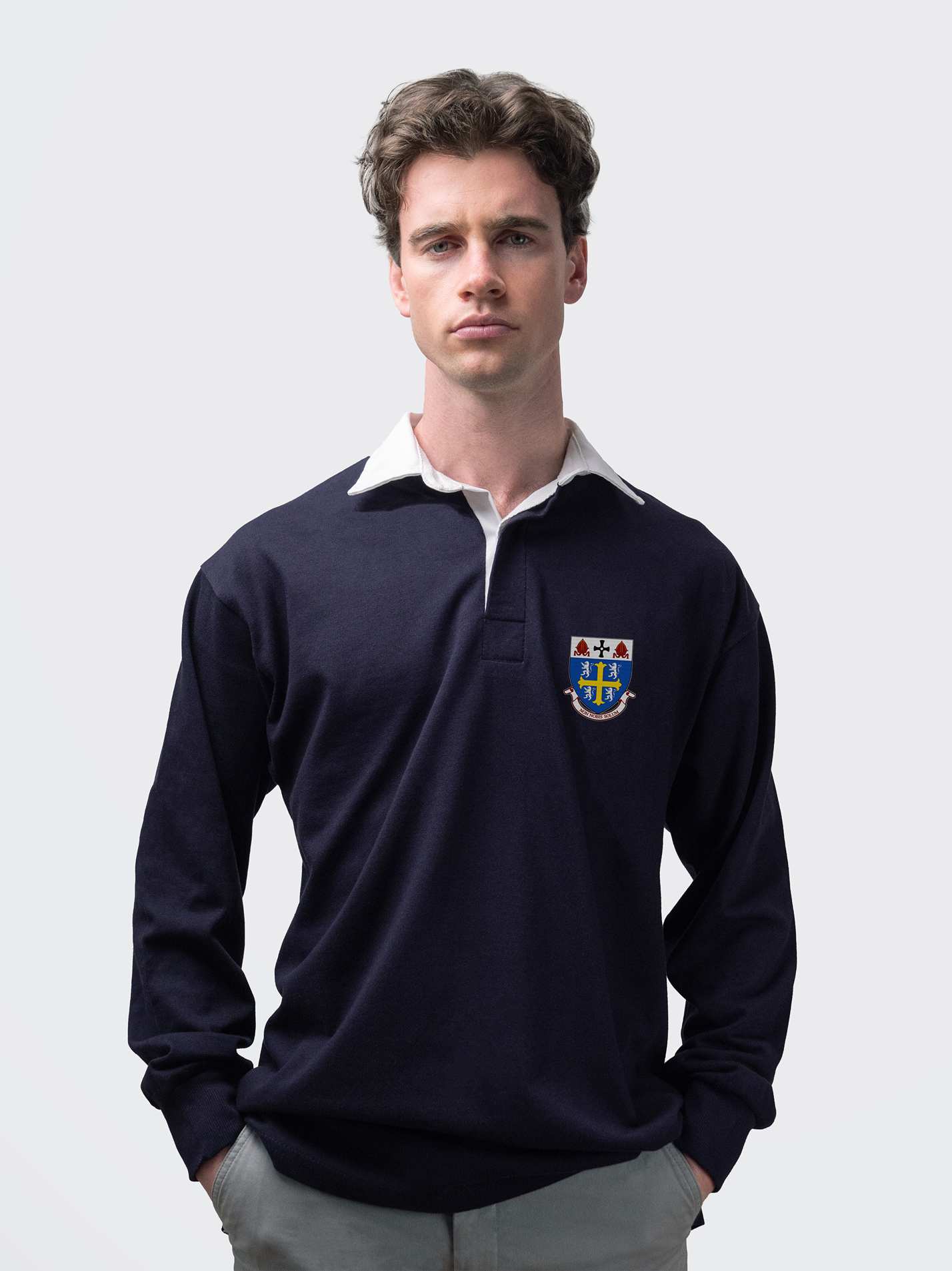 University College student wearing an embroidered mens rugby shirt in navy