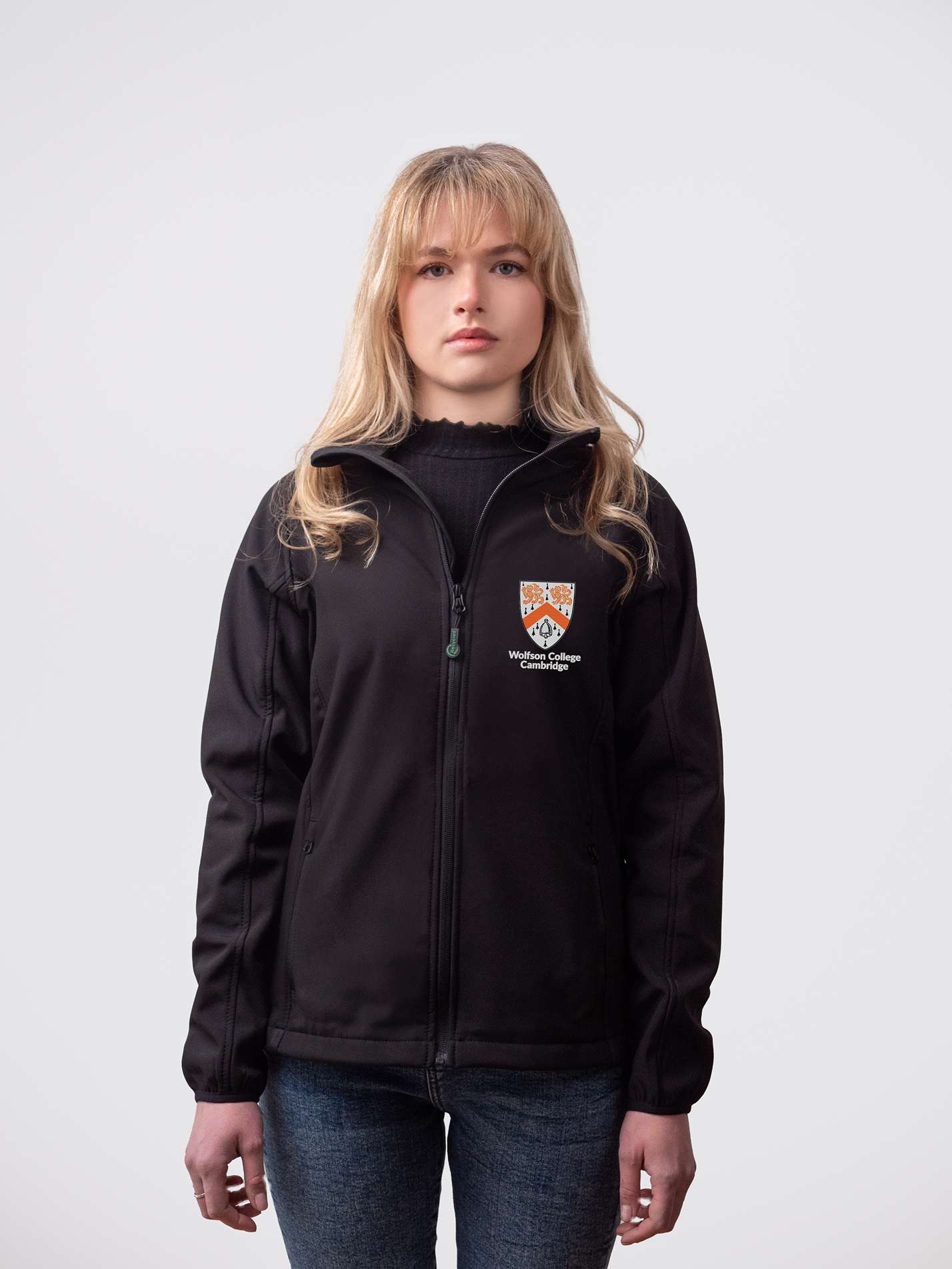A student wearing a sustainable, Wolfson College embroidered jacket