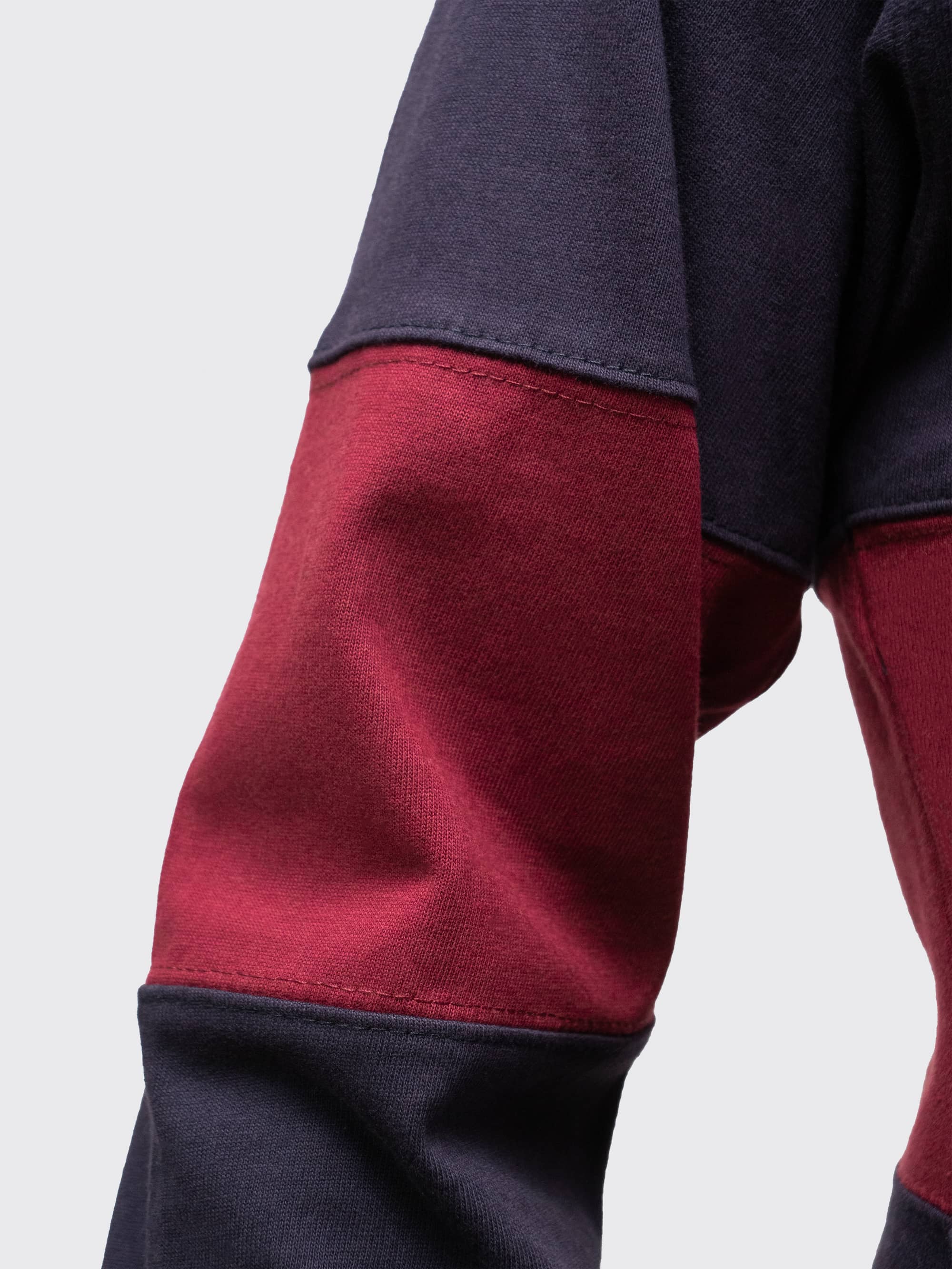 Heavyweight navy and burgundy fabric, with twin-needle stitch detail